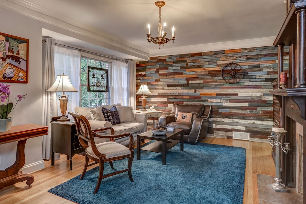 Our spacious living room features a wall of 120 year old beaded board, an antique mahogany victorian mantel, original white oak floors, stained glass, and comfortable furniture. Our large flat screen tv has roku, both packages for loads of entertainment.