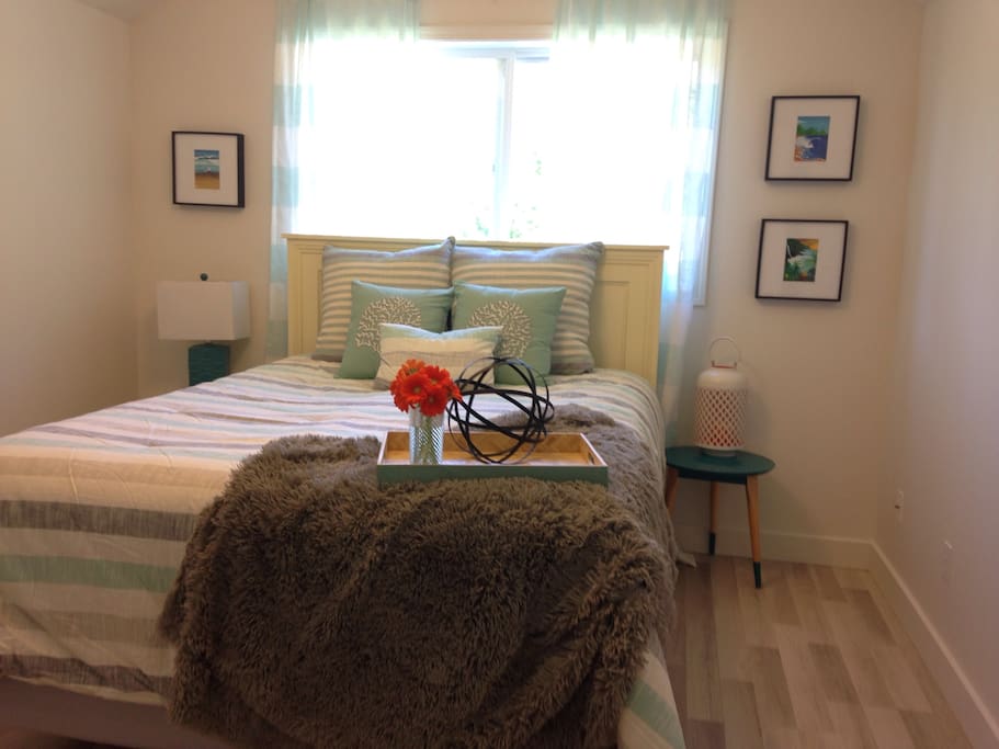 Vaulted Ceilings and Large screened windows make the Master Bedroom feel light and airy.