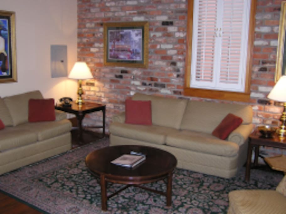 Picture of living room in a large renovated suite. Our suite is similar but not quite as large.