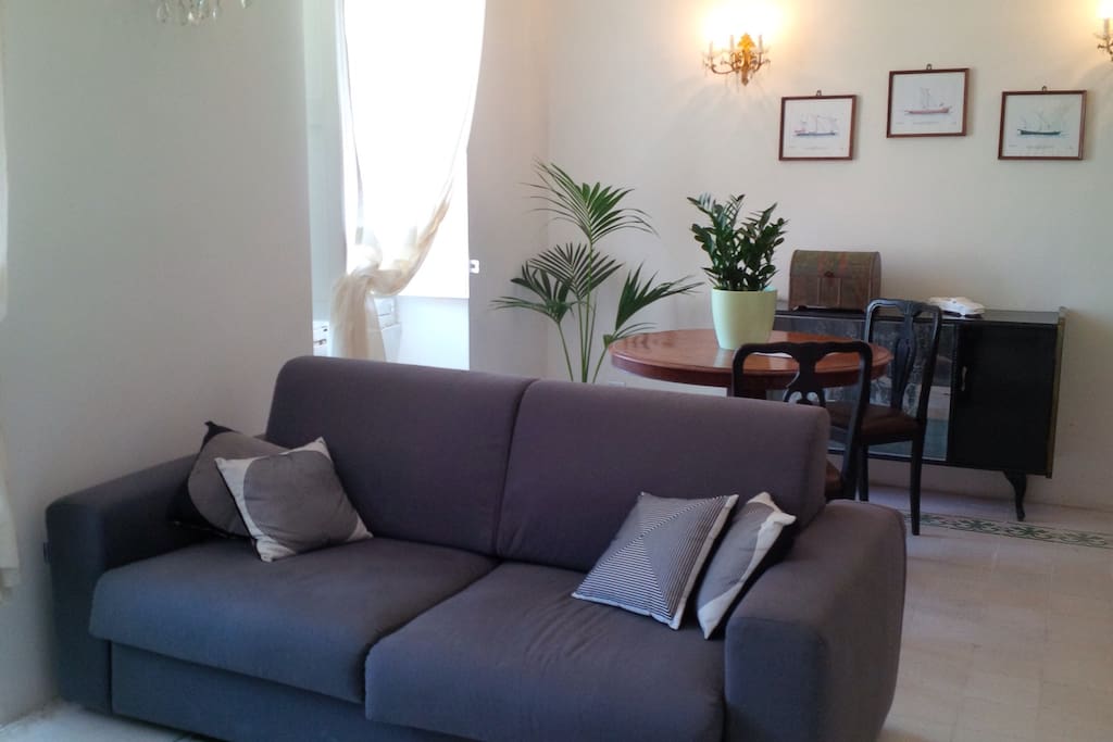 Chateaux D'ax sofa bed in spacious living room .