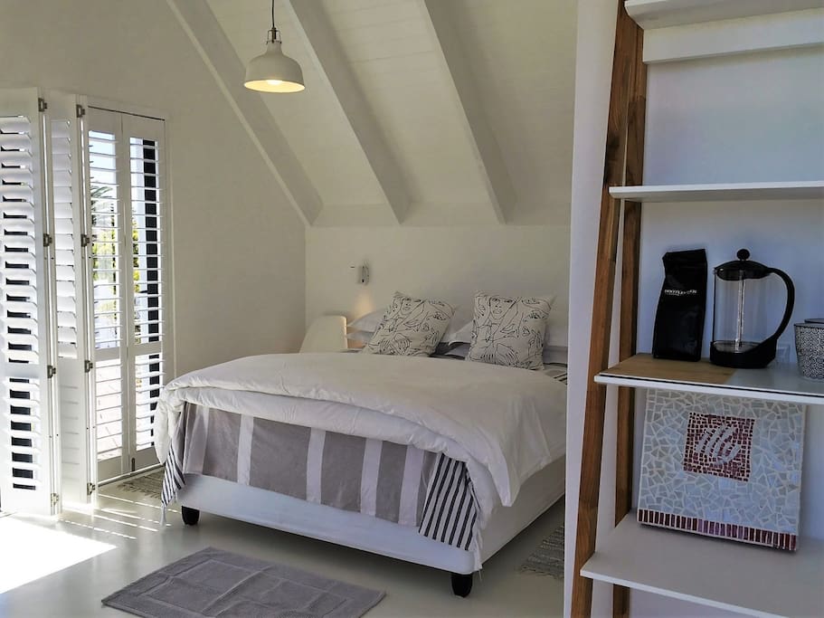 Bedroom 1 - American Shutters drench the room in filtered sunlight