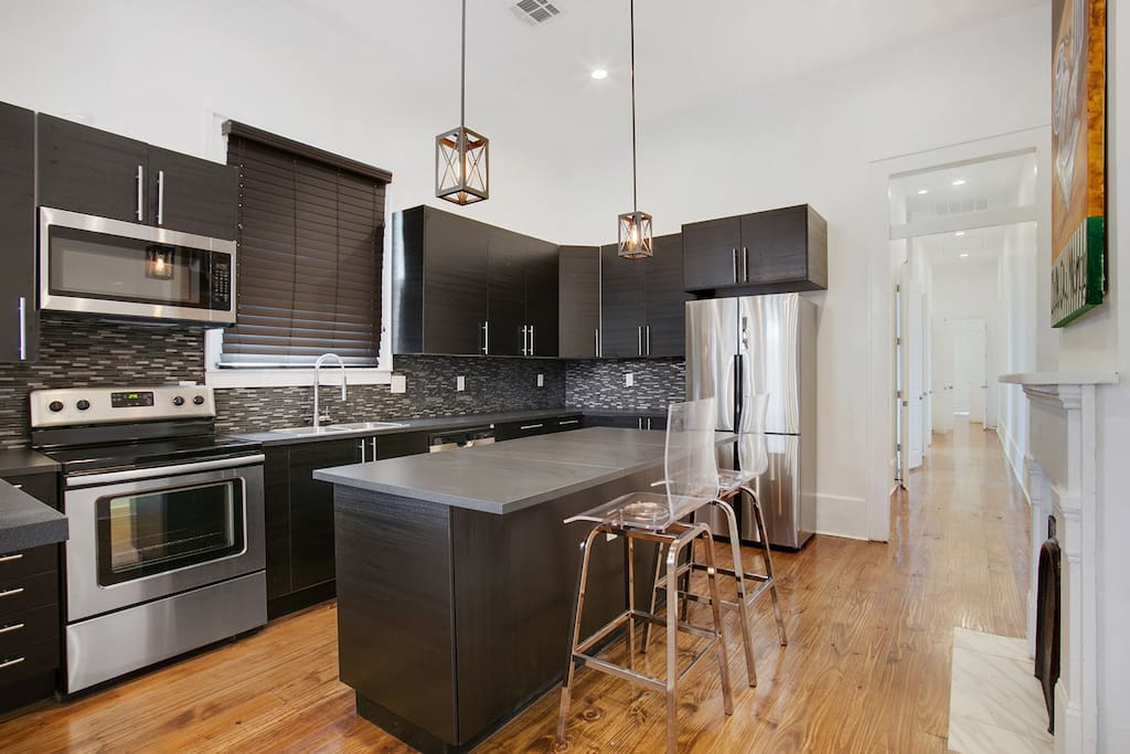Fully stocked kitchen with coffee maker, stove, microwave and all necessary amenities.