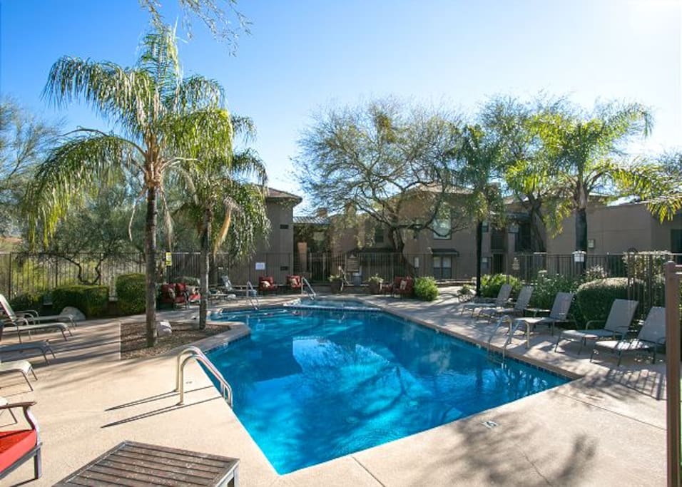 The pool is located steps away from the condo.