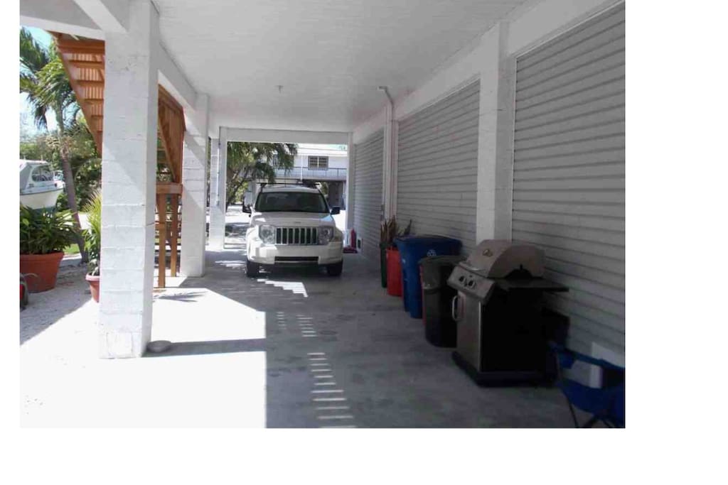 view under house looking out towards street