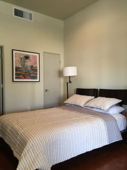 A very comfortable queen bed with your own closet
