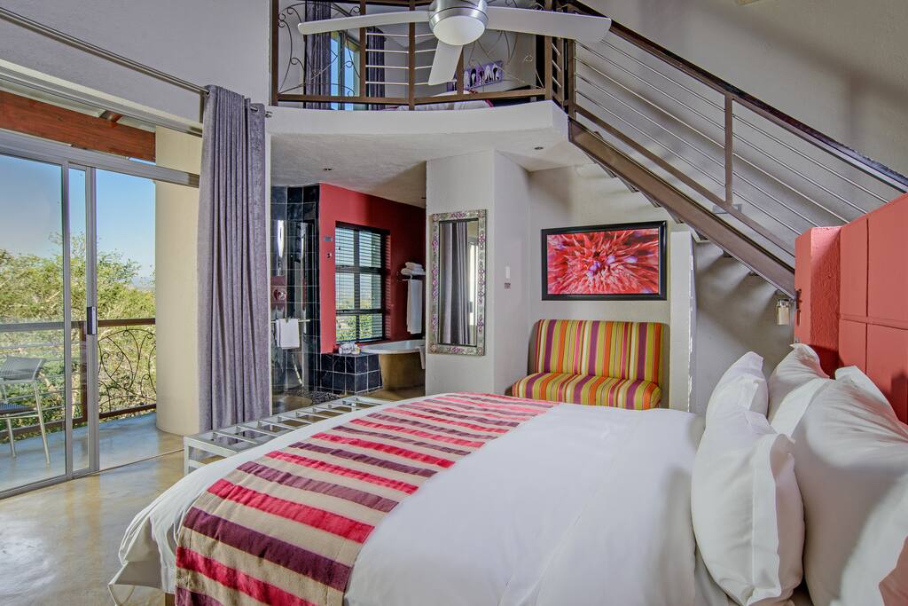 Family suite for a family up to 4 guests with full en-suite bathroom; private balcony; fully stocked minibar and snack bar (not included in rate) and microwave. Modern, open-plan design.
