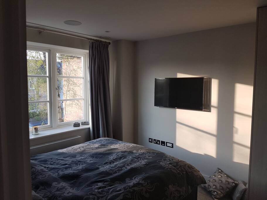Master bedroom with ensuite and tv