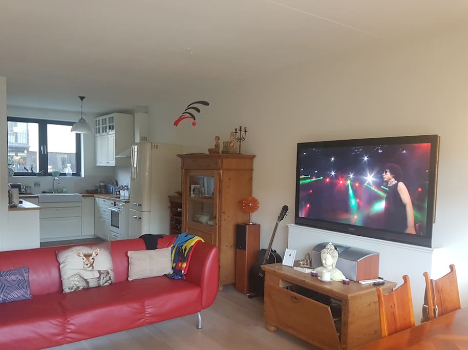 the living room with the tv elevated