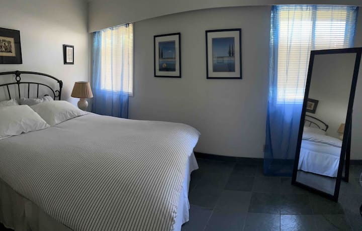Spare bedroom with queen size bed.