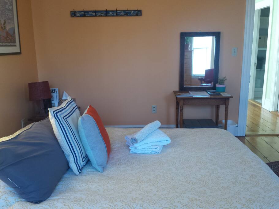 View of bathroom entrance and front apartment entrance from your guest room