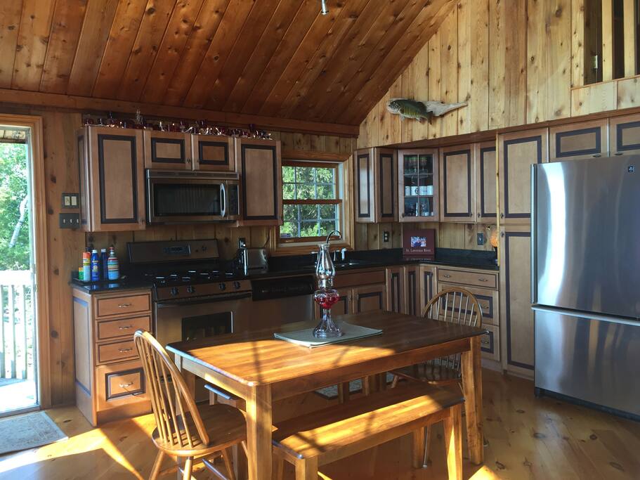 fully equipped kitchen with granite countertops and stainless appliances