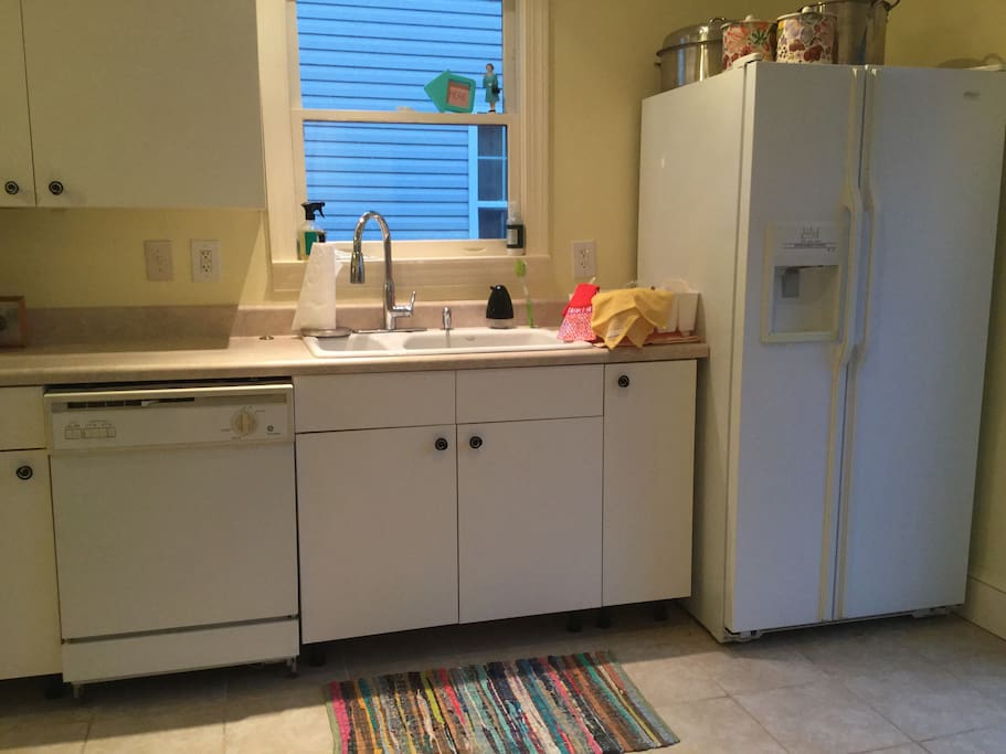 Fridge, Keurig, drip coffee maker, French press (freshly ground Starbucks French Roast) all for your use & dishwasher for your convenience.