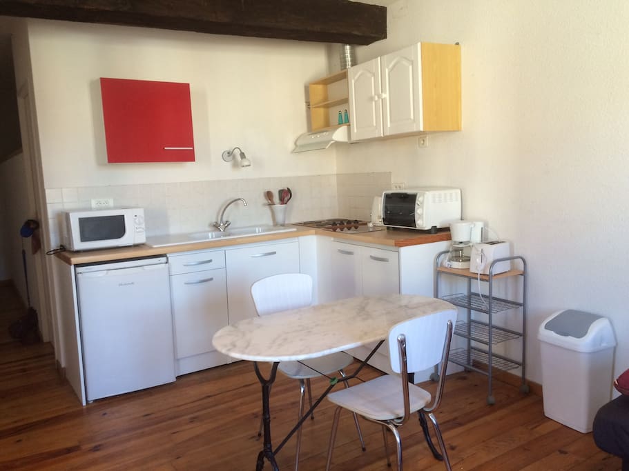 Well equipped kitchen area, washer in hall.