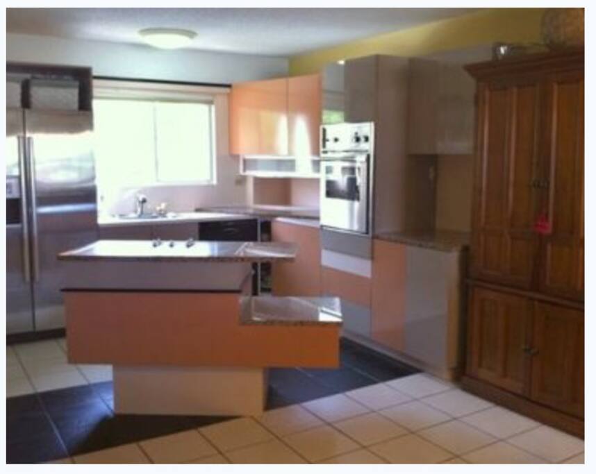 Kitchen with dishwasher and full laundry