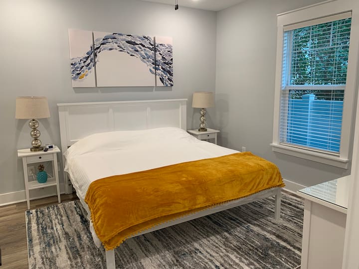 The luxurious master bedroom includes a king bed and large closet.