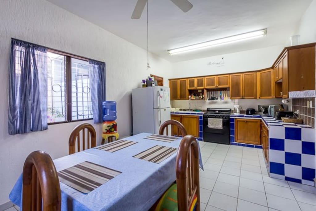 A colorful eat in kitchen has all the necessary amenities