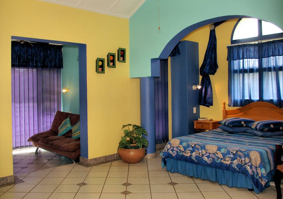 Room 2 - 1 double bed, 1 sleeper couch and a bathroom with a shower