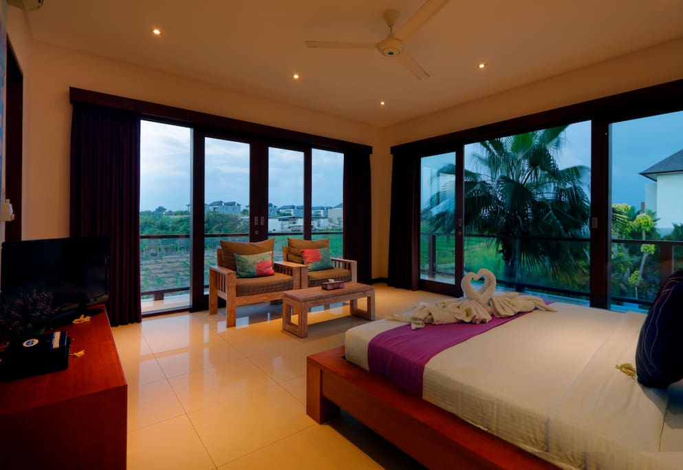 Bedroom with large windows and abundance of natural light