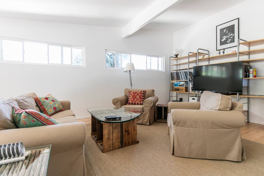 light,open living room flows into dining area