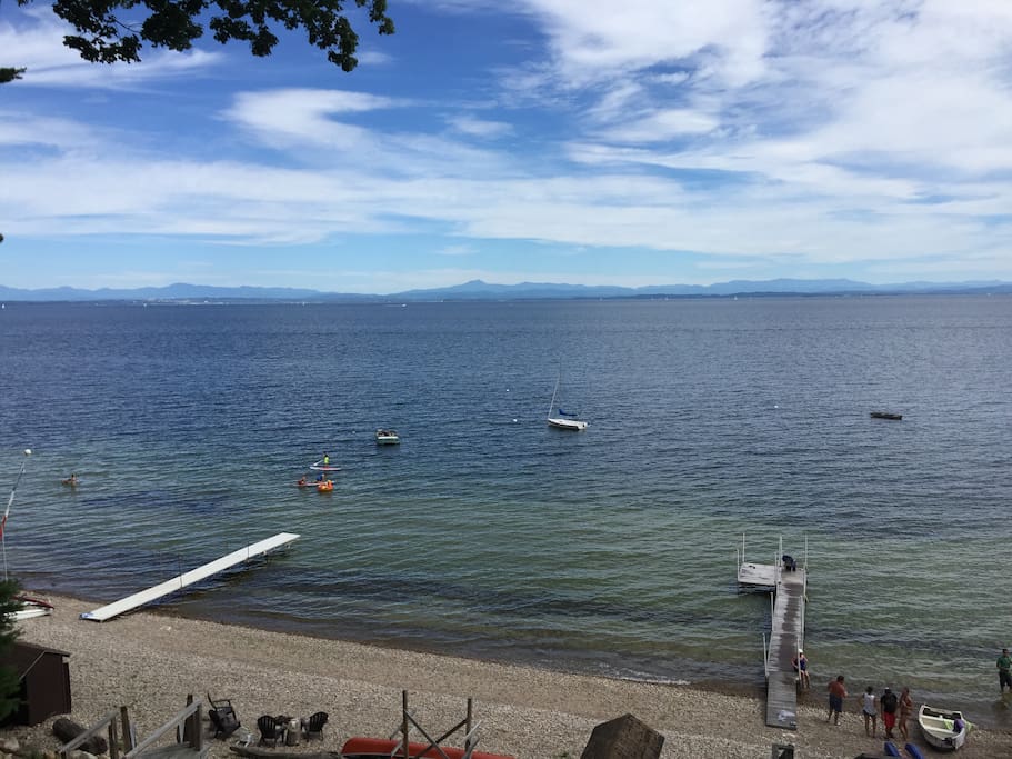 View of lake and stone beach from upper porch, can see across the lake to Burlington, VT