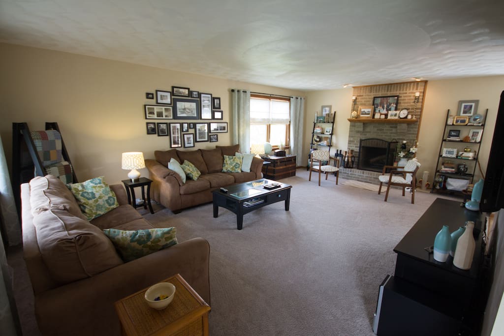 Large open living room with 2 full size couches