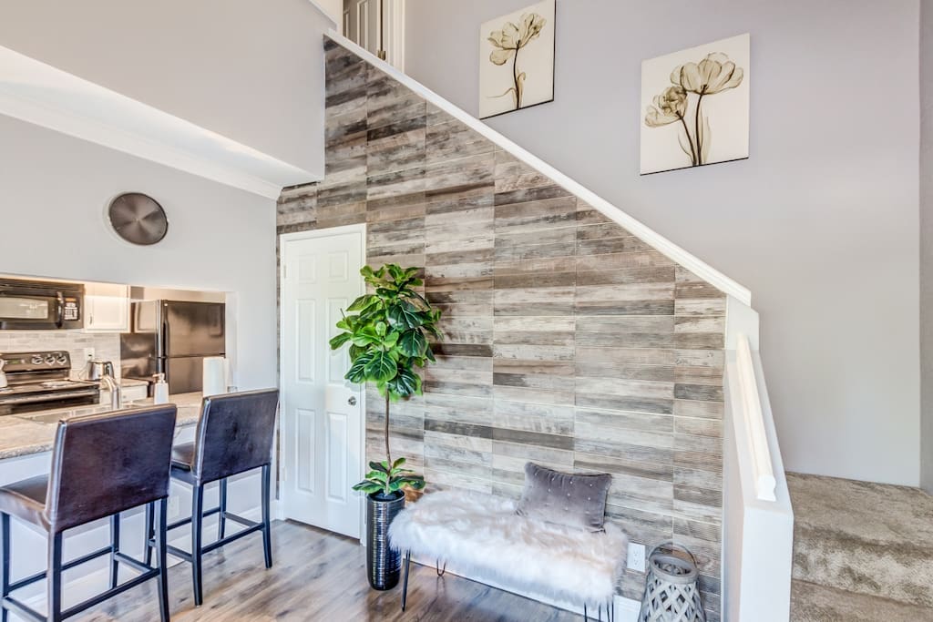 Cozy bar area allows you to chat with guests while cooking a meal or preparing drinks.