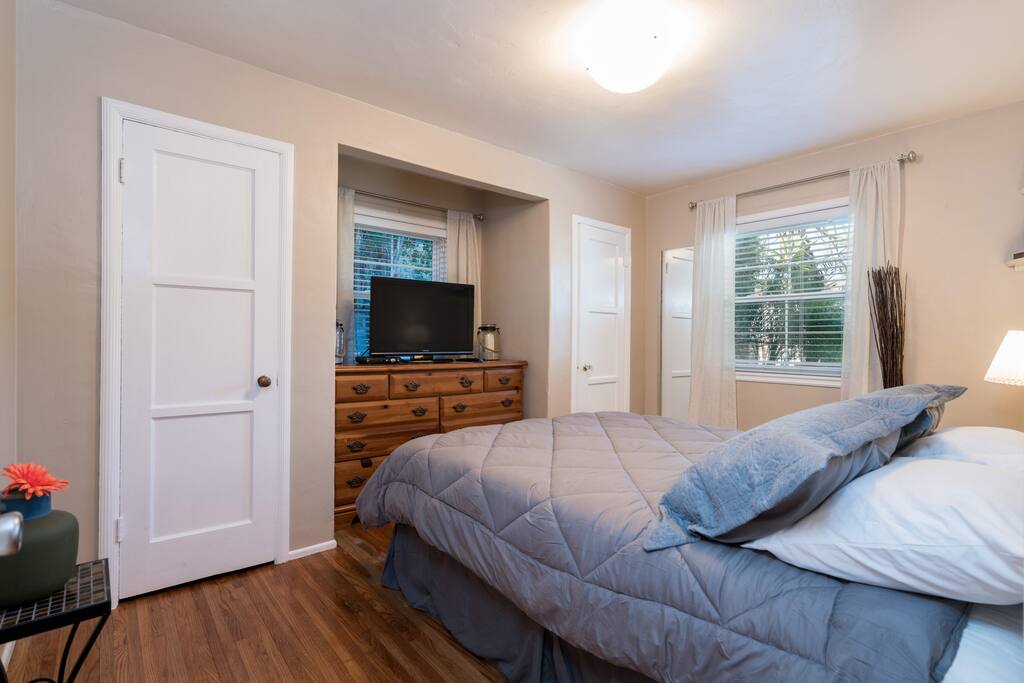 Main House Bedroom No. 2 with Queen Bed, Dresser, and Two Closets