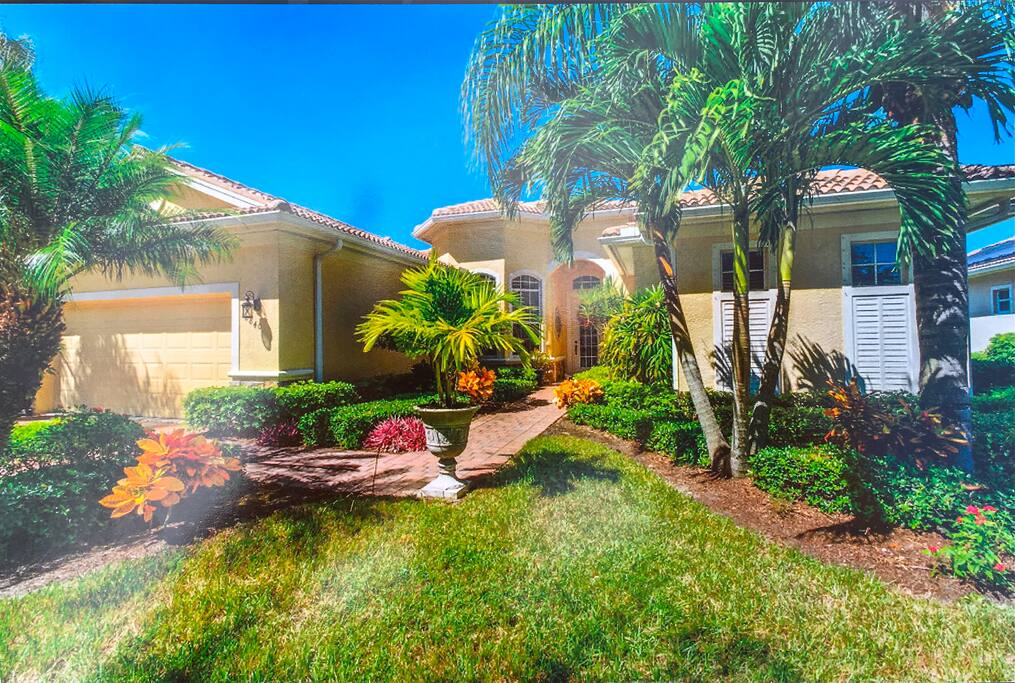 AMAZING ENTRY WITH COLORFUL LANDSCAPING