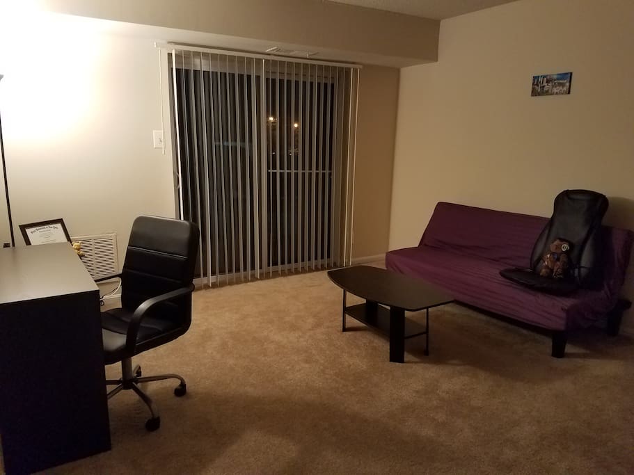 Shared Living Room when I am in the apartment. Otherwise, private space when I'm out of town. Massage chair on the sofa and desk available to work on. Sliding doors to the front area of the building/ parking space.