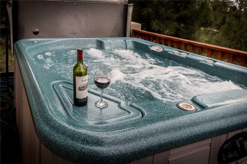 Upper Hot Tub Living - A relaxing soak in the hot tub after a day of shopping is the perfect end to a long day.Deck Hot Tub