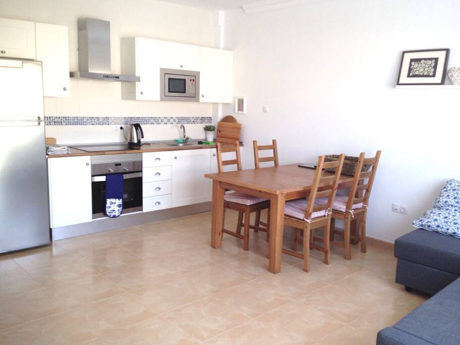 Fresh clean modern well equipped kitchen/dining/living room