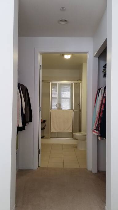 Walk-in closet, bathroom with large shower