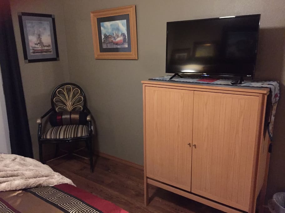 Chest, Internet ROKU TV and chair.