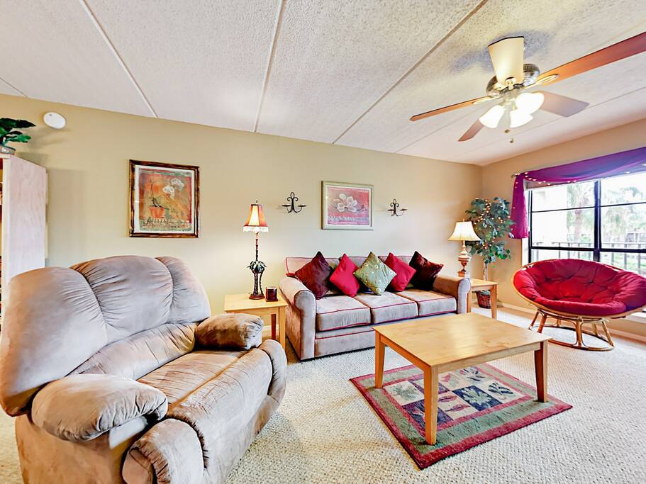 Kick back in the living area—comfortable seating awaits you after a fun-filled day in the sun.