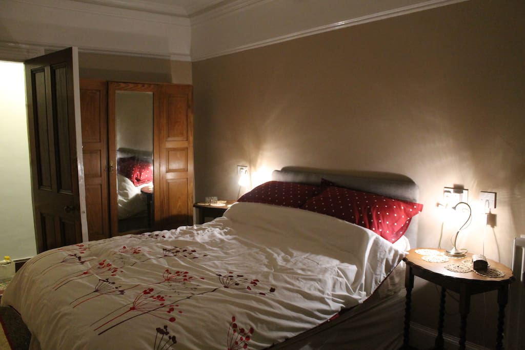 Comfortable double bedroom with fireplace