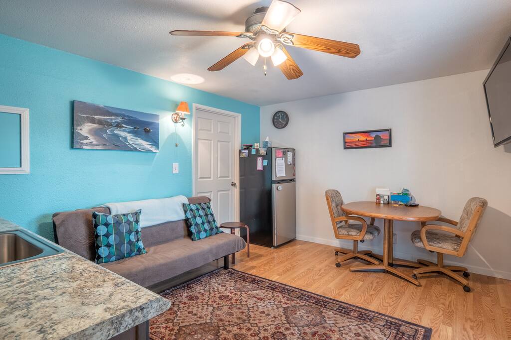 3/4 size fridge, table seats 2-5, couch converts to small futon - best for kids.