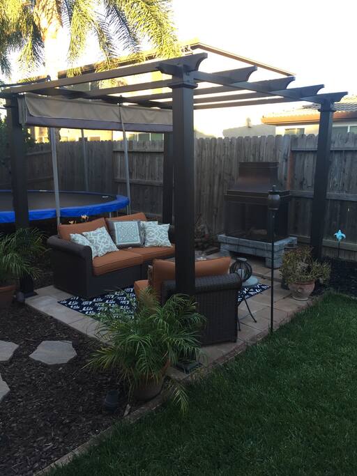Cuddle up with a book in front of the outdoor fireplace.