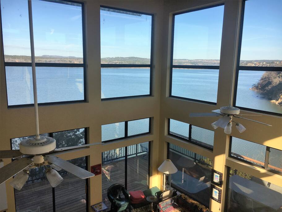 Large floor to ceiling windows show off full lake view