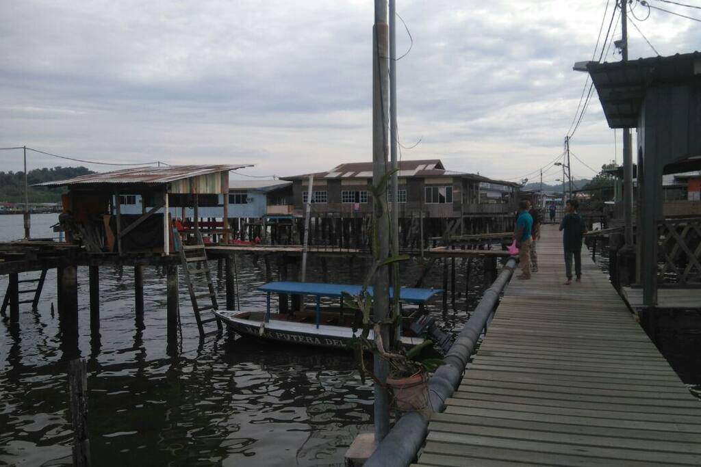 Still houses connected by wooden bridges to every corner of water village.