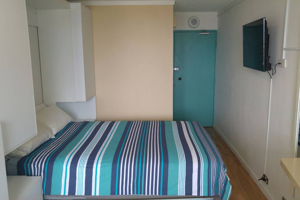 Comfortable queen size bed and 39" HD TV