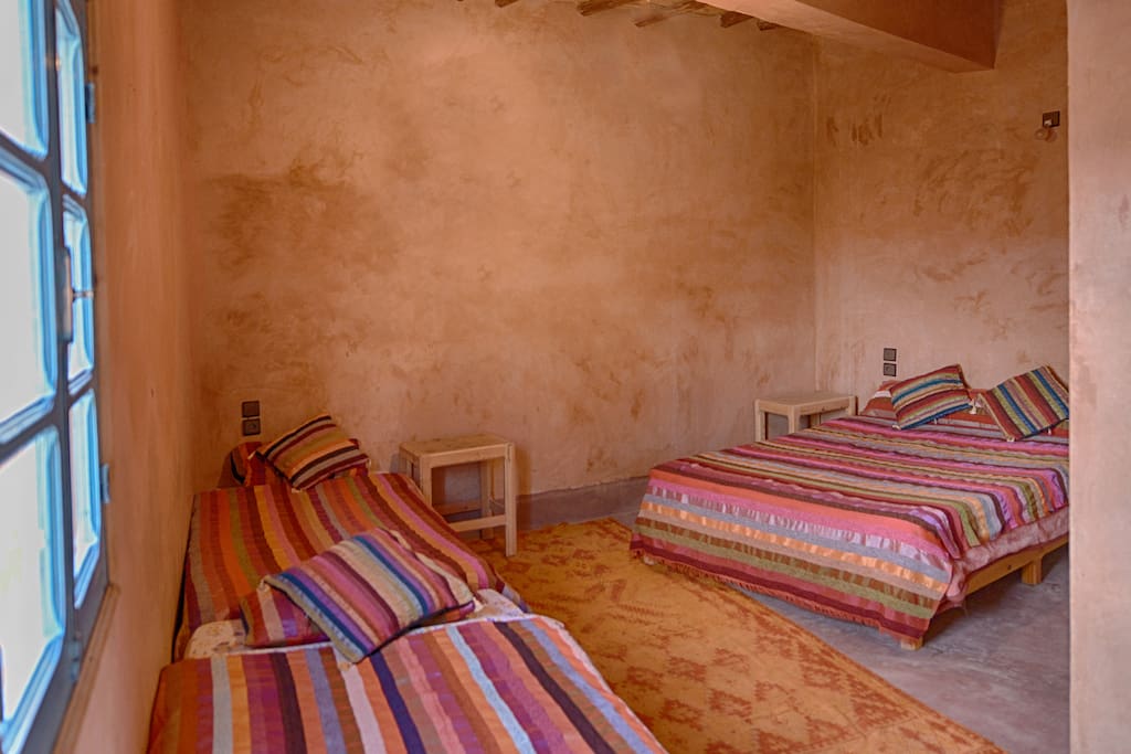 Family room featuring 1 Double bed and 2 Single beds and private bathroom