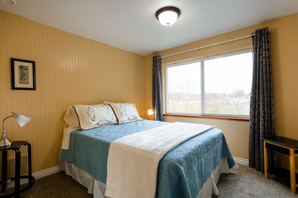 Bedroom number 3 with a gorgeous view of nature from the second story.