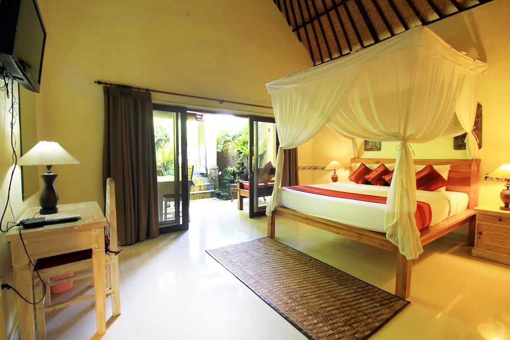 The King Size Bed With Comfortable Mattress and Mosquito net.