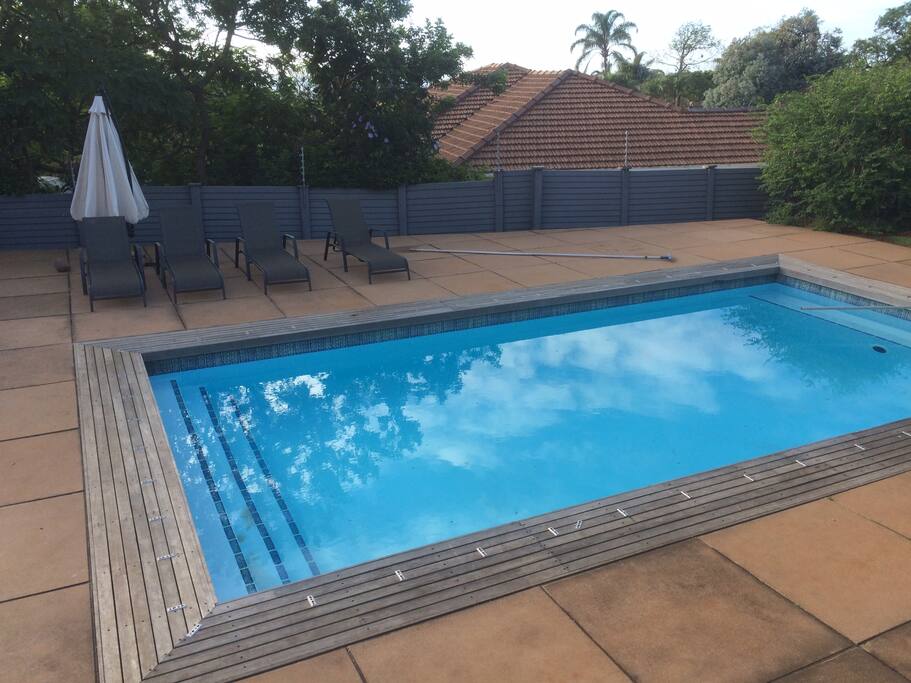 big pool with X4 loungers
