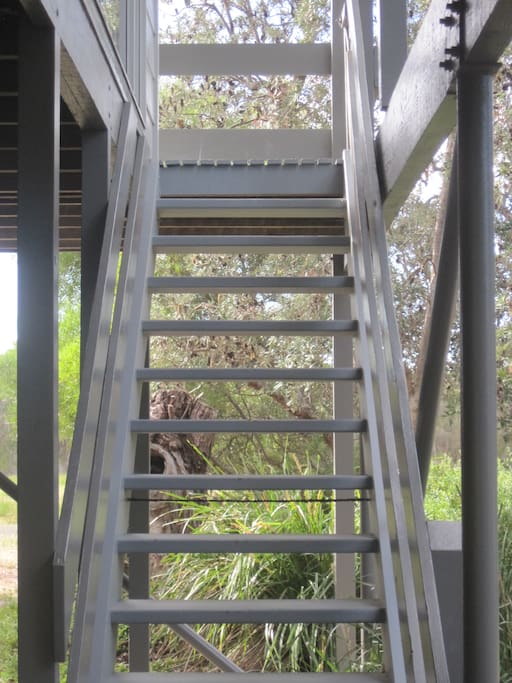 Stairs to balcony and front door