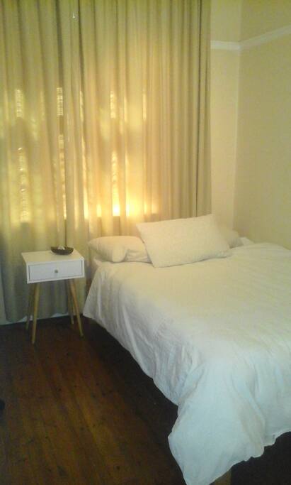 Clean, fresh room with closet and a king size
bed