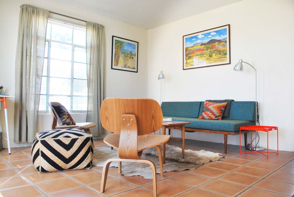 The living room showcases art by local artists.