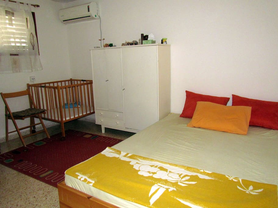 the room setting with a crib, for a couple and their baby