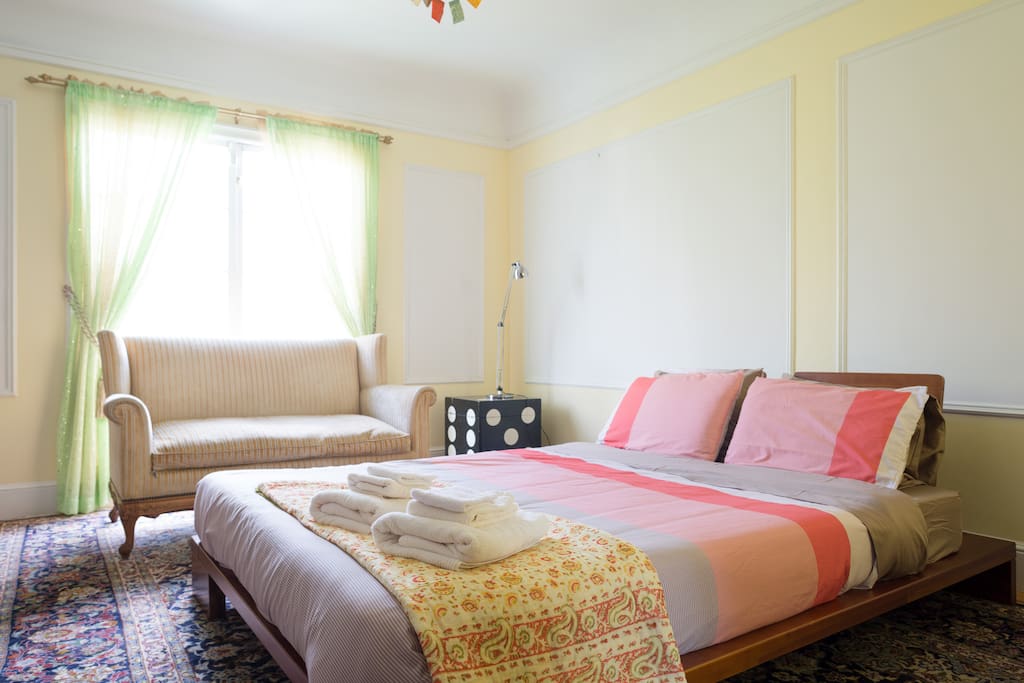 Bedroom with French windows and natural light.