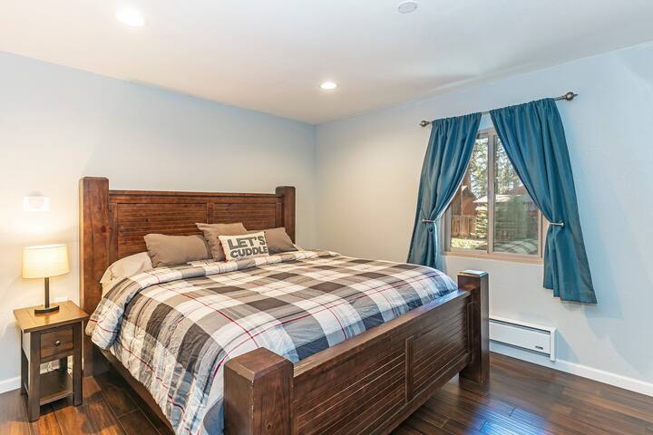 Master bedroom includes a luxurious king-size bed, tv, and USB chargers. 